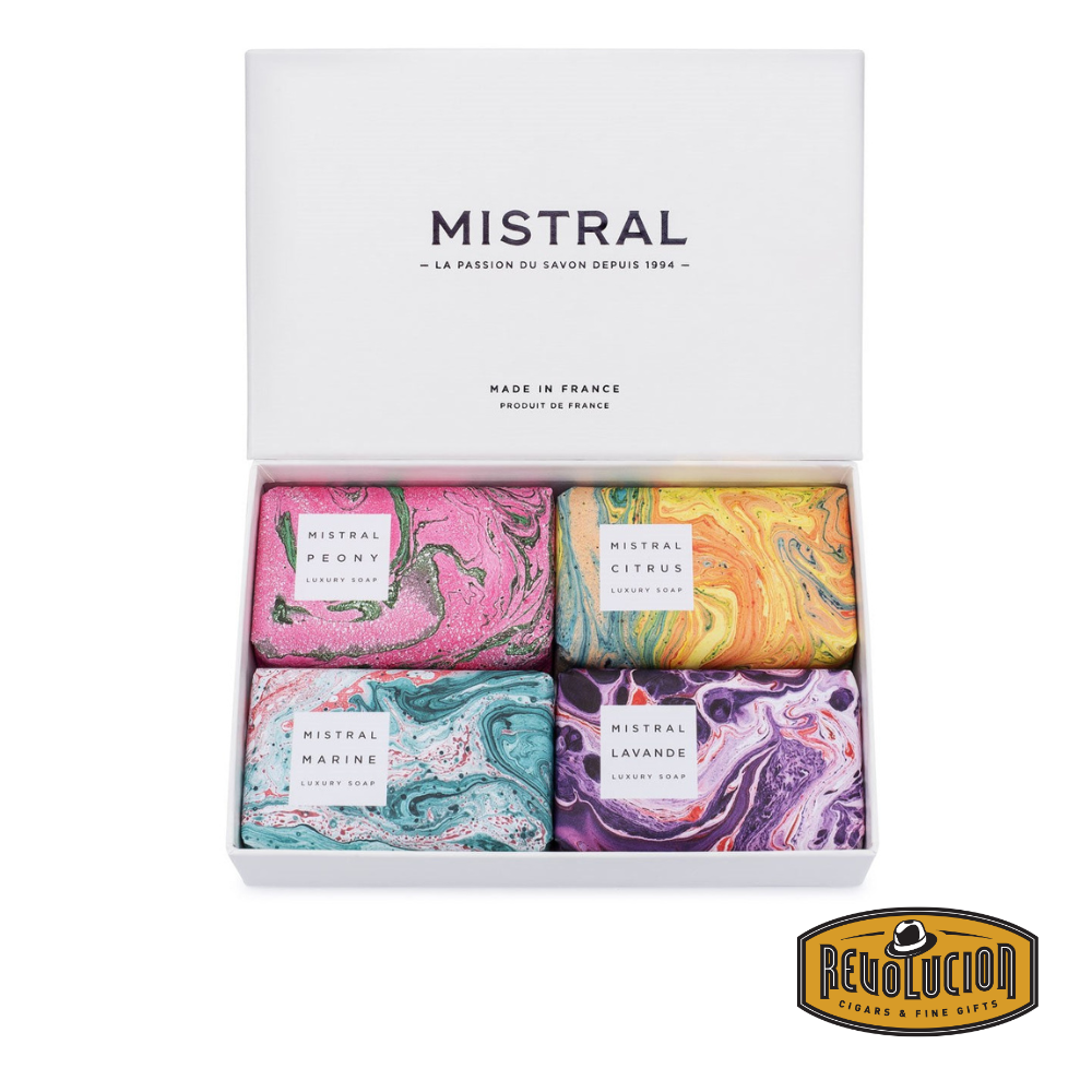 Elegant Mistral luxury soap gift set in a sleek white box, featuring four vibrant, marbled soap designs: Peony, Citrus, Marine, and Lavande. Made in France and perfect for building your own personalized gift. Includes the Revolucion Cigars &amp; Fine Gifts logo