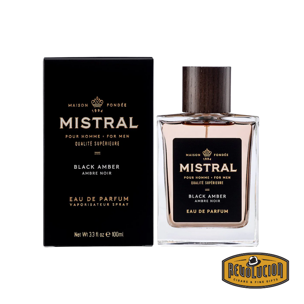 Mistral Black Amber Eau De Parfum – A bold and masculine fragrance featuring deep amber notes, presented in a sleek glass bottle with a dark wood cap and elegant black packaging.