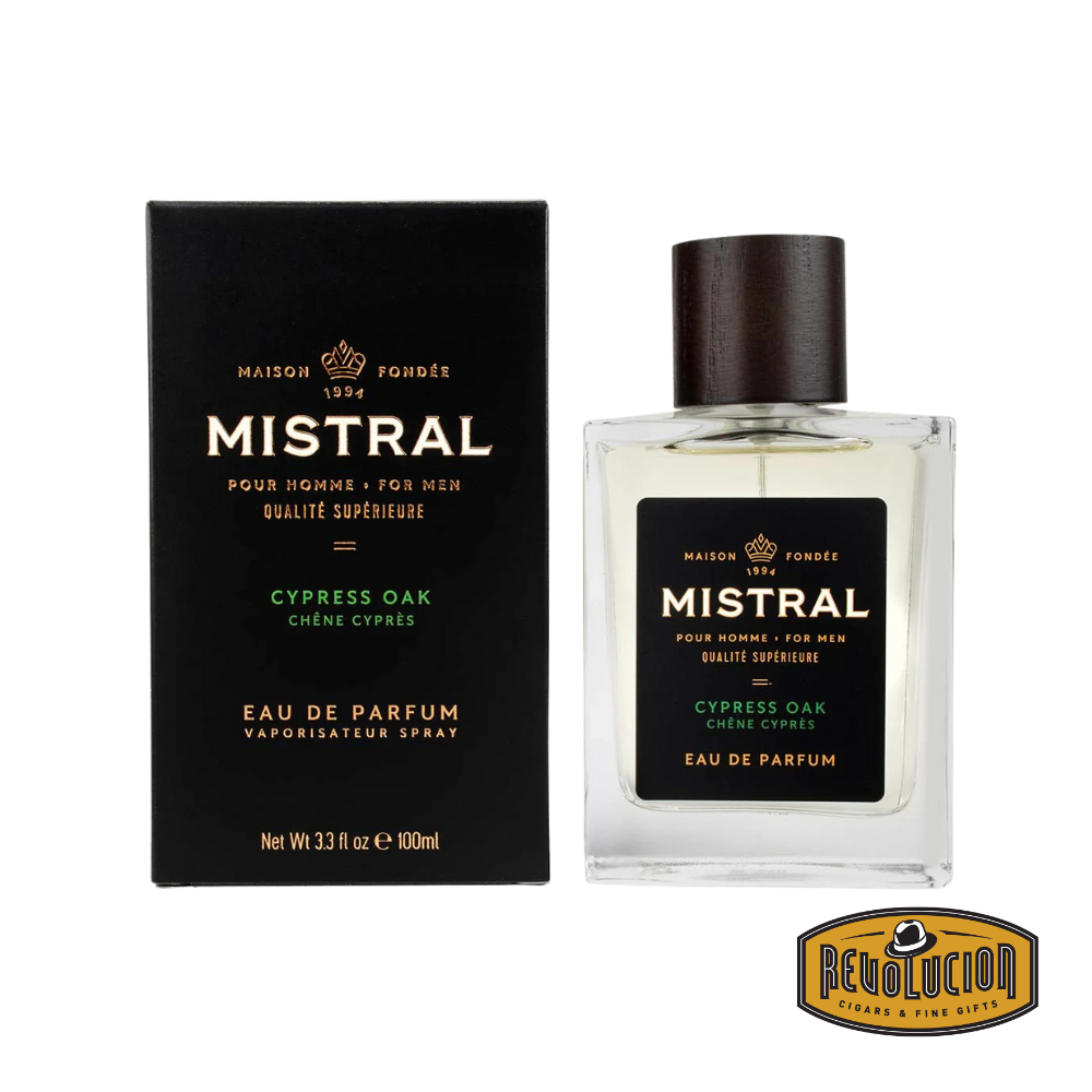 Mistral Cypress Oak Eau De Parfum – A refined fragrance for men, featuring fresh cypress and robust oak notes. Presented in an elegant glass bottle with a dark wood cap and sleek black packaging.
