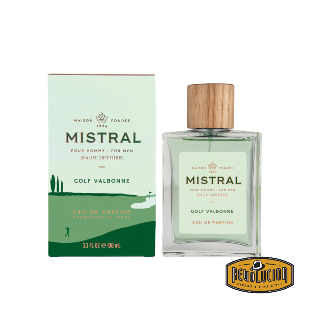 Mistral Men's Golf Valbonne Eau De Parfum – a sophisticated, cylindrical glass bottle with a sleek black cap, embodying refined masculinity and fresh elegance.