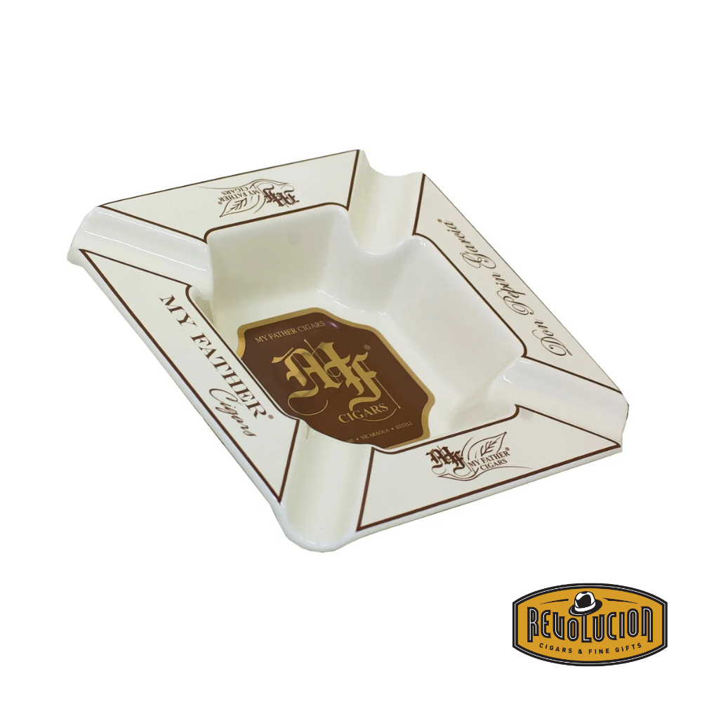 Top view of the My Father Cream Ashtray, showcasing its elegant cream finish, gold accents, and the My Father Cigars logo, displayed with the Revolucion Cigars & Fine Gifts logo.