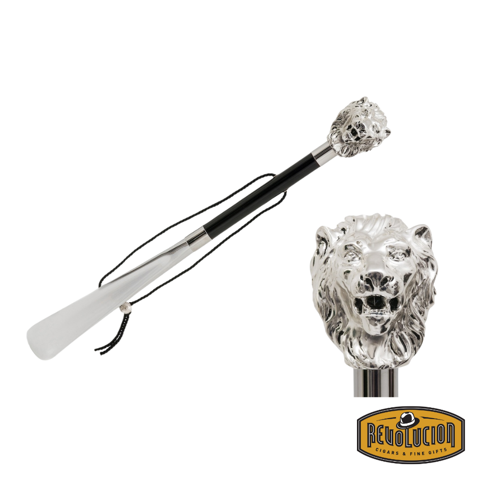 Pasotti Shoehorn featuring a majestic silver lion head handle, a sleek black shaft, and a durable leather strap for added convenience.
