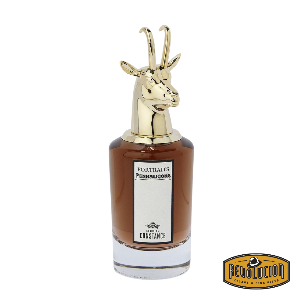 A close-up of Penhaligon’s Changing Constance Eau de Parfum bottle, highlighting its frosted glass, gold detailing, and the distinctive sculpted deer head cap.