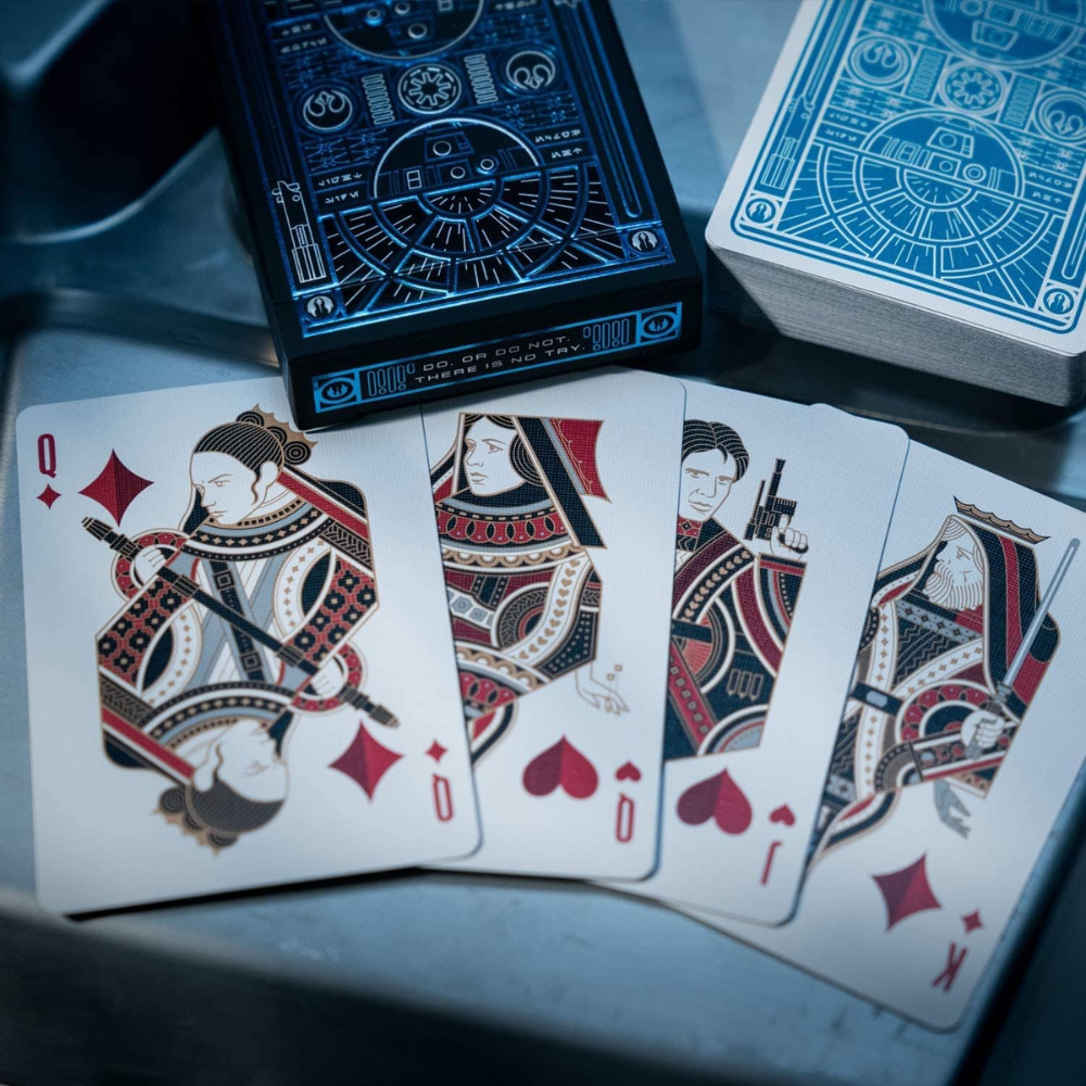 Inside view of the Theory11 Star Wars Playing Cards - The Light Side, displaying character illustrations and detailed card backs.