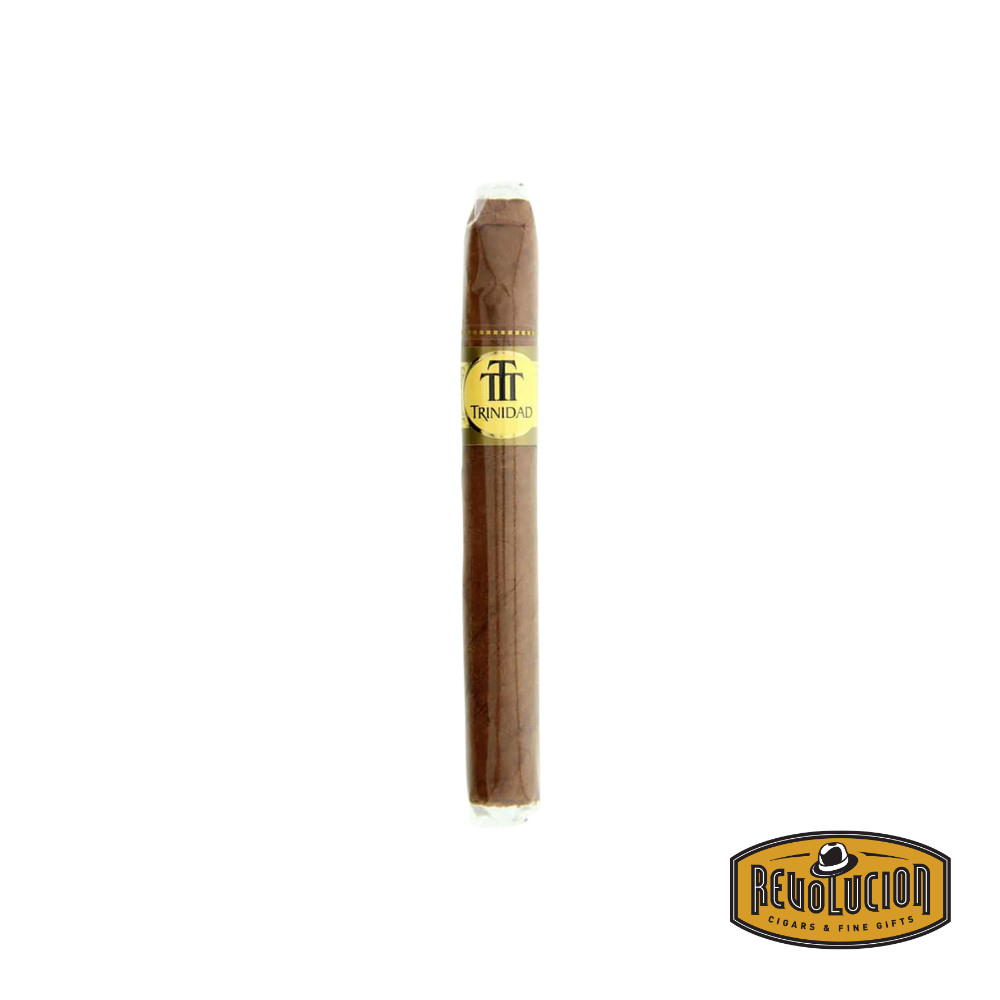 A single Trinidad Shorts medium-strength Cuban cigarillo resting on a surface, showcasing its smooth wrapper and compact size.