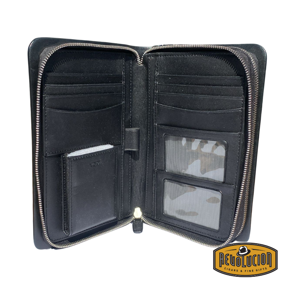 Opened Tumi Bedford Double Zip Clutch revealing organized interior compartments and zip sections.