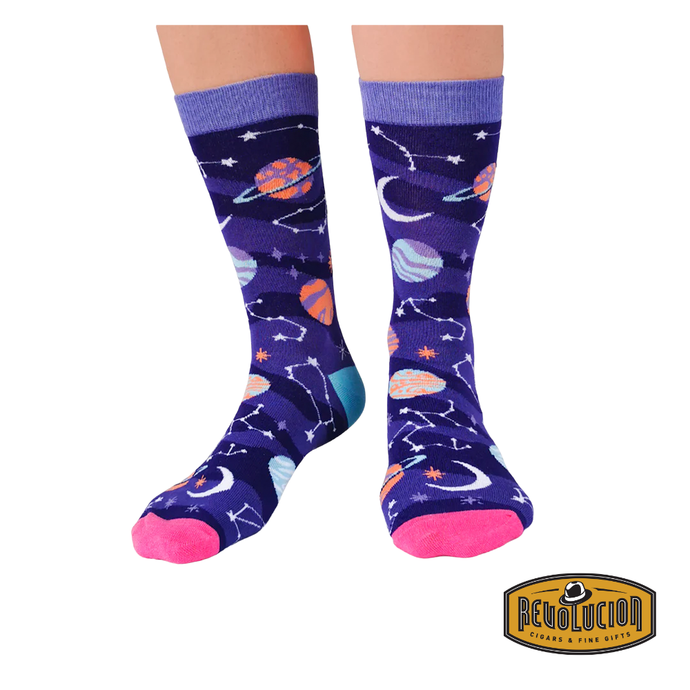 Front view of purple socks adorned with vibrant celestial graphics, including planets, stars, and constellations. The socks feature light purple cuffs, pink toes, and turquoise heels.