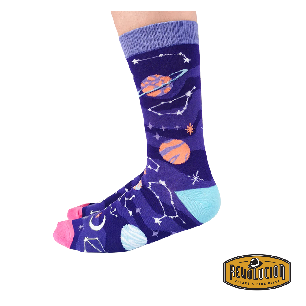 Side view of purple socks featuring colorful celestial graphics, including planets, stars, and constellations. The socks have light purple cuffs, pink toes, and turquoise heels.