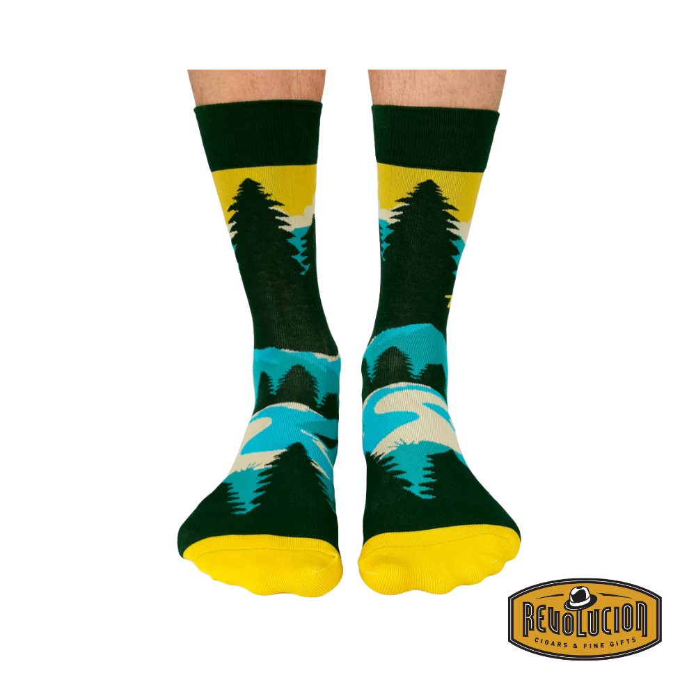 Front view of Uptown Take a Hike calf-length cotton unisex socks, featuring a vibrant outdoor-inspired design with mountains, trees, and a bold "Take a Hike" slogan.