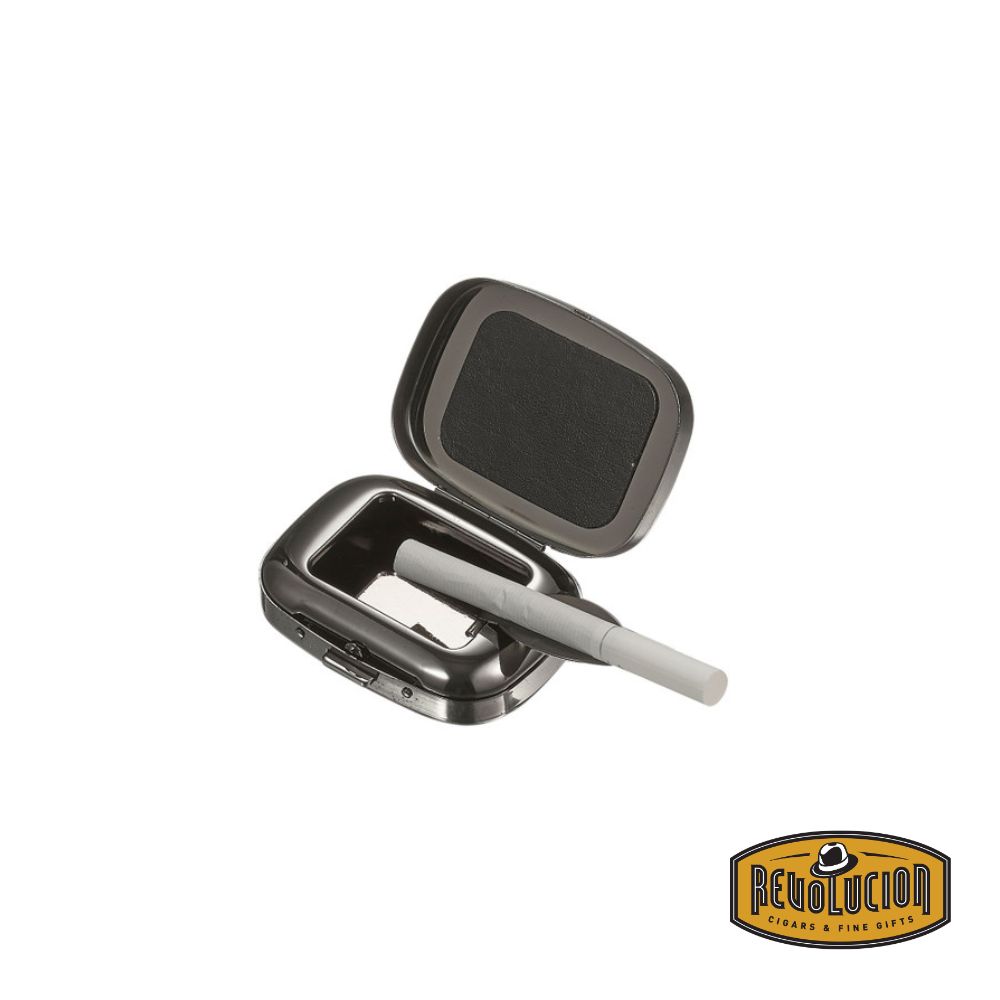 Opened Visol Jerome Gunmetal Plated Pocket Ashtray with a cigarette resting inside, showcasing its compact and functional design.