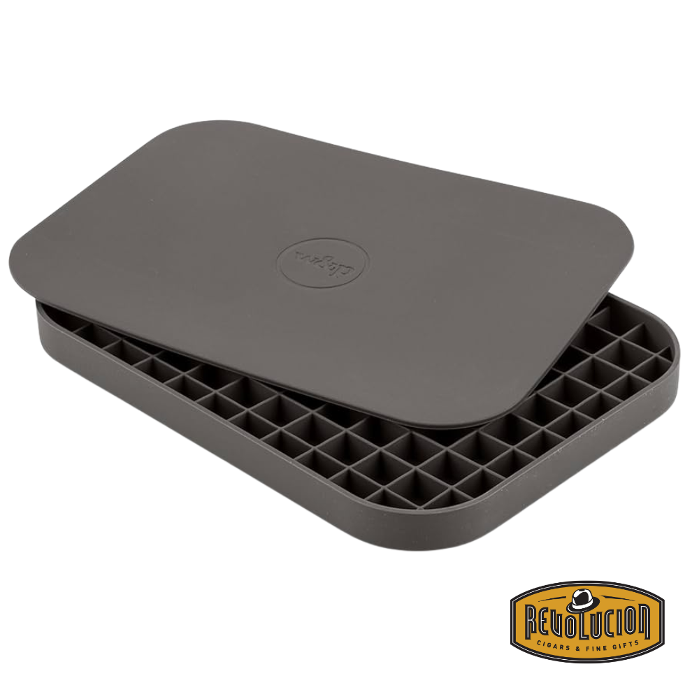 W&P Cocktail Ice Pebble Tray in charcoal, shown empty to display its sleek silicone design.
