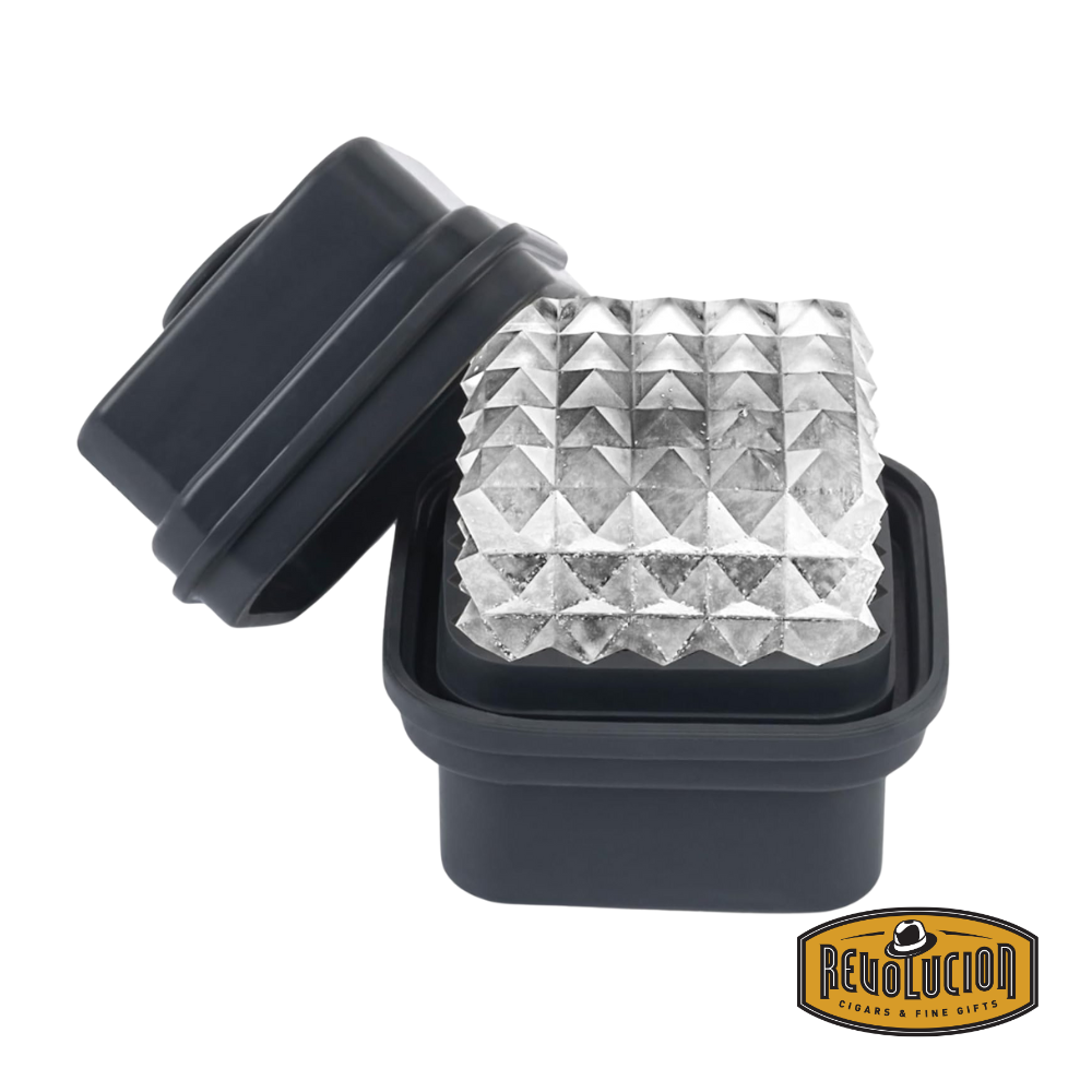 W&P Prism Ice Cube Tray in charcoal with a geometric prism-shaped ice cube resting inside.