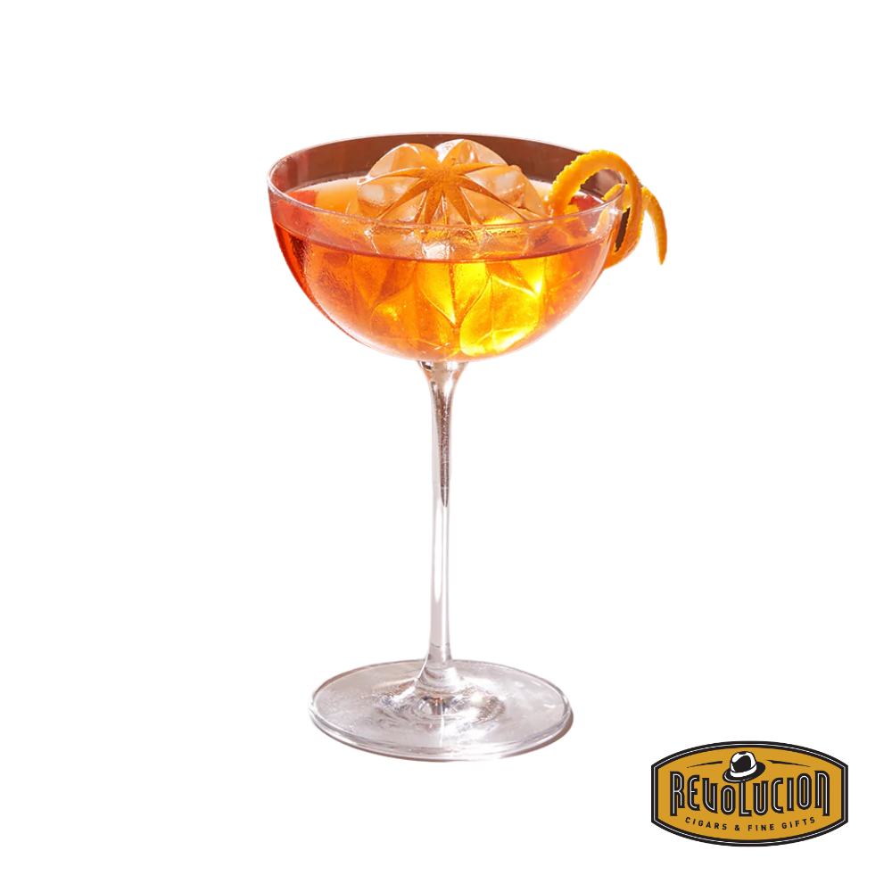 Elegant orange cocktail featuring a large ripple ice cube made with the W&P tray, highlighting its visual appeal.