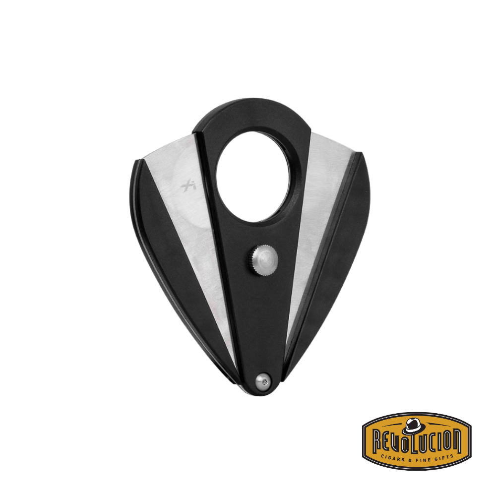 Xikar Xi2 cigar cutter in black with stainless steel double blades fully opened, showcasing its precision cutting mechanism. The Revolucion Cigars & Fine Gifts logo is in the bottom right corner.