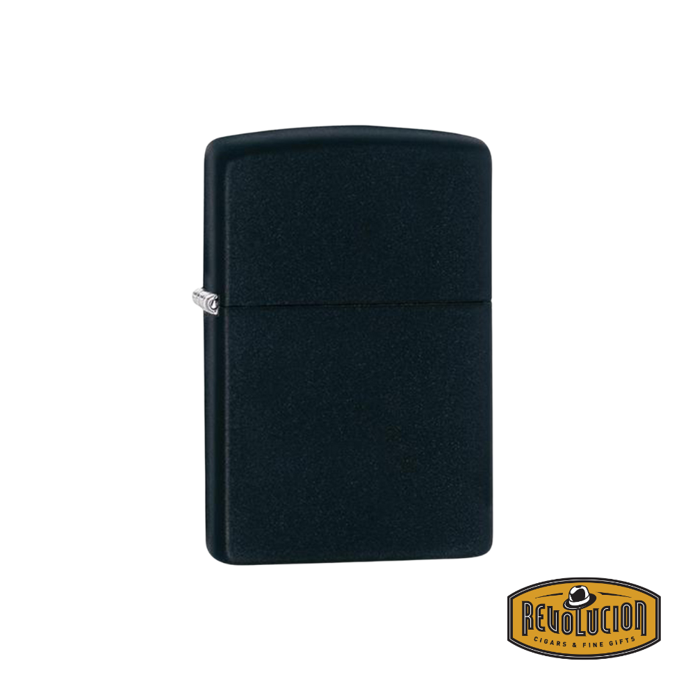 A Zippo Solid Black Matte Lighter with a sleek, smooth matte black finish, featuring the Revolucion logo in the corner.