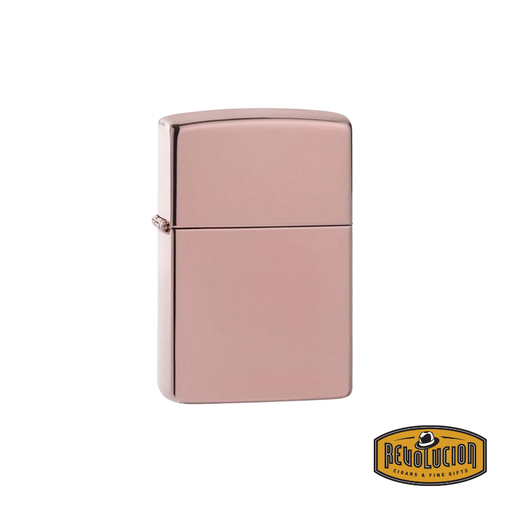 A luxurious and elegantly crafted Zippo lighter with a polished solid rose gold finish. The smooth, reflective surface exudes sophistication, making it a perfect accessory for collectors and enthusiasts.