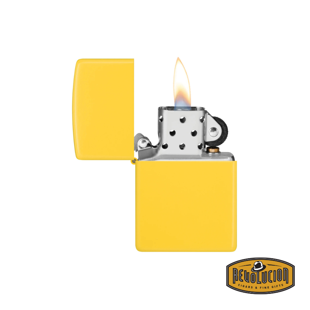 A Zippo Sunflower Yellow Matte lighter in an open position with a lit flame, showcasing its classic windproof design. The Revolucion Cigars & Fine Gifts logo is displayed in the bottom right corner.