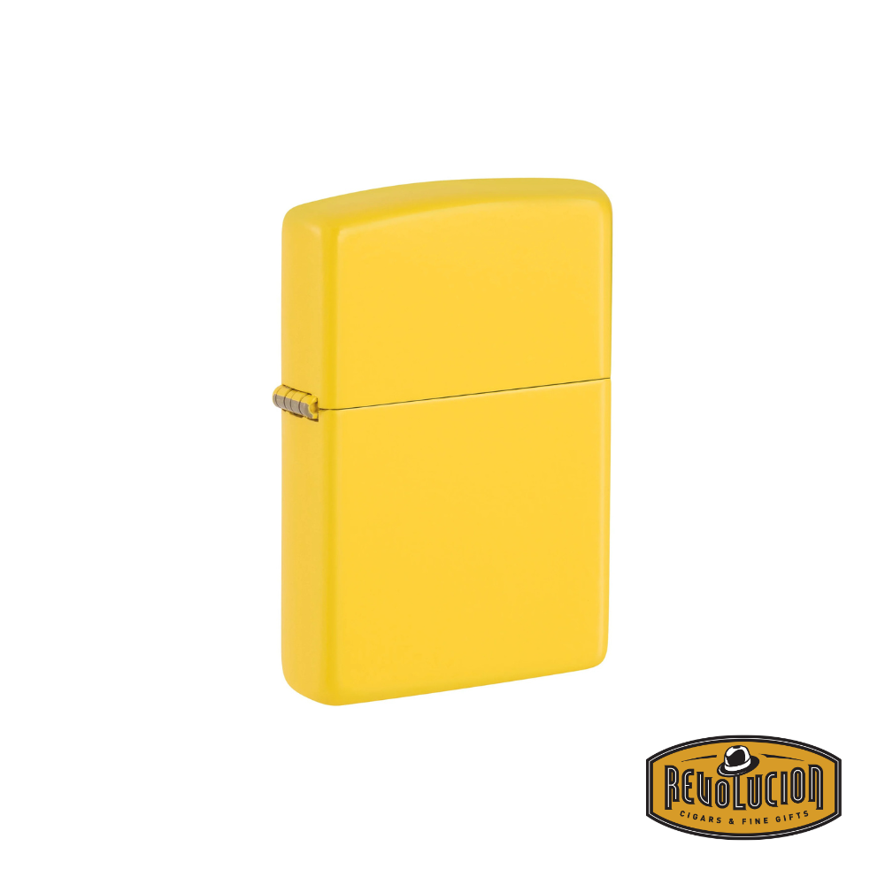 A Zippo Sunflower Yellow Matte lighter in a closed position, featuring a smooth matte finish and a vibrant yellow color. The Revolucion Cigars & Fine Gifts logo is visible in the bottom right corner.