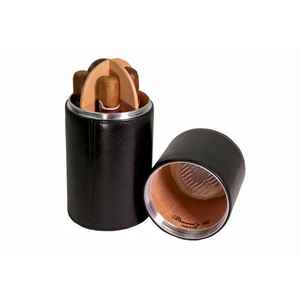 A black leather cylindrical desk humidor with the lid off, revealing a Spanish Cedar-lined interior and multiple cigars stacked inside. The humidor is designed to fit into compact spaces, with a visible humidifier secured under the lid