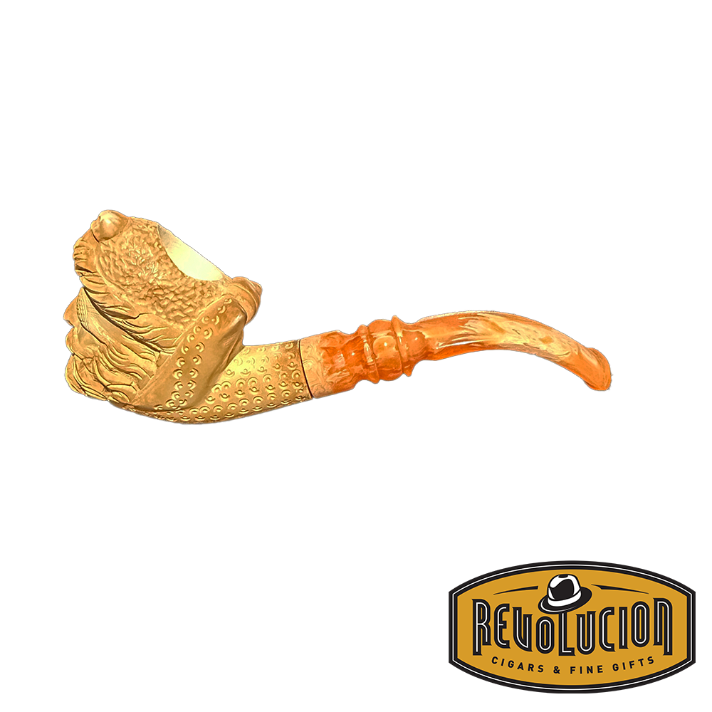 Profile view of a Meerschaum smoking pipe with a detailed pirate head carving and a vibrant orange marbled stem. The bowl features an elegant lattice finish, highlighting the craftsmanship