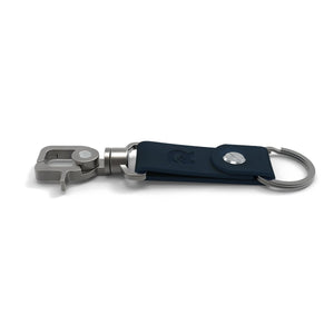 The Ridge Aluminum and Leather Keychain. Navy Blue with The Ridge logo stamp embossed.