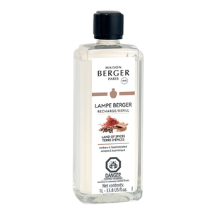 Indulge in the warm and inviting scent of Lampe Berger Land of Spices fragrance oil in the convenient 1 liter size. This beautifully designed bottle features a frosted finish and a black cap, with a label displaying the product name and branding. 