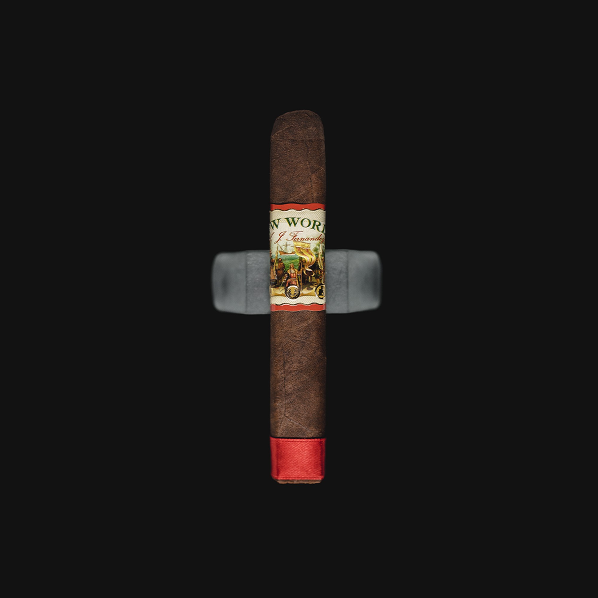 AJ Fernandez New World Oscuro Navegante Robusto Medium-Full Strength Nicaraguan Cigar on a white background with the Revolucion logo, showcasing its dark, oily wrapper and detailed band design.