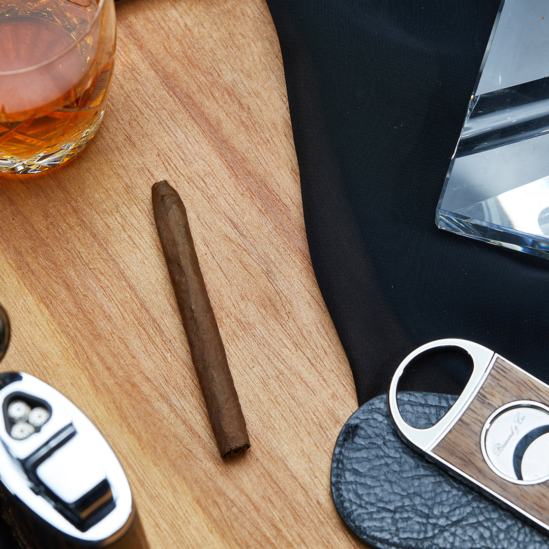A single Azan Corto Medium Strength Nicaraguan Club Cigarillo, showcasing its premium construction.