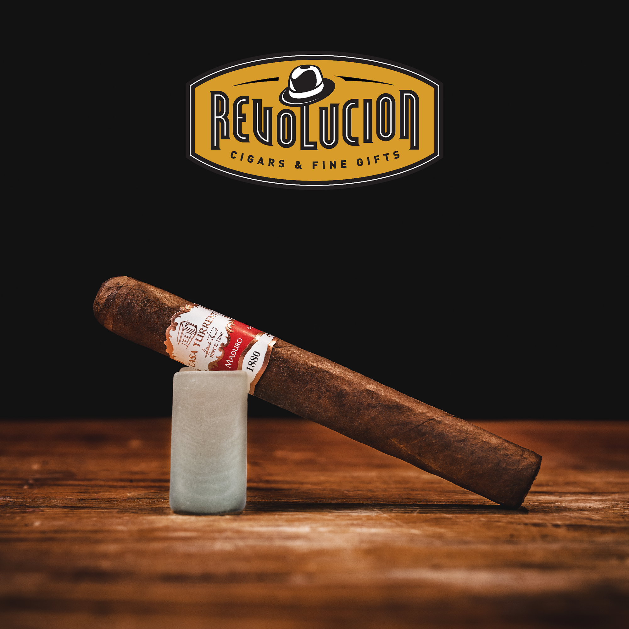 Casa Turrent 1880 Double Robusto Maduro cigar, positioned at an angle to highlight its smooth construction and rich color.