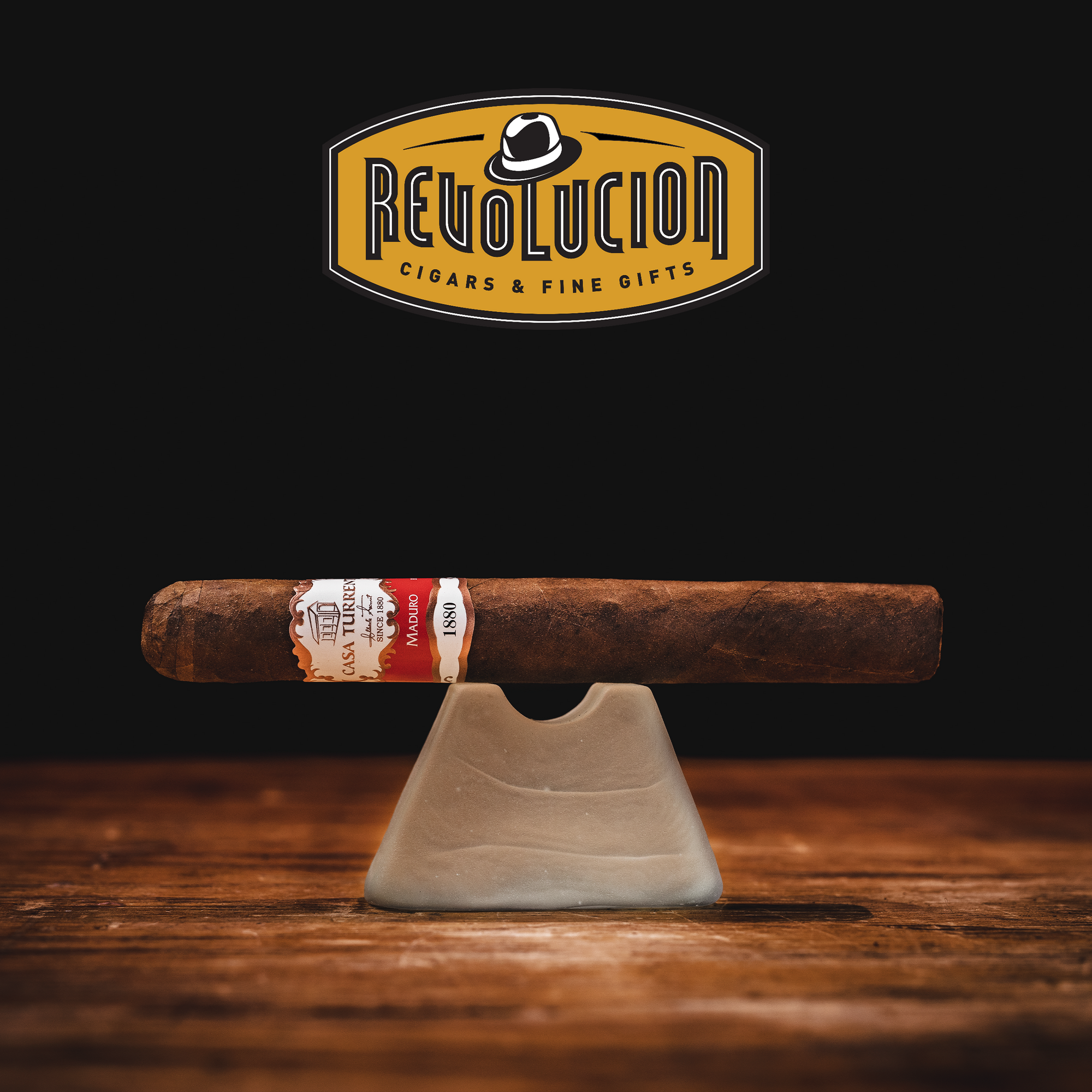 Casa Turrent 1880 Double Robusto Maduro Medium Strength Mexican Cigars featuring a dark, rich Maduro wrapper with a smooth and bold profile, displayed on a wooden surface with a white background.