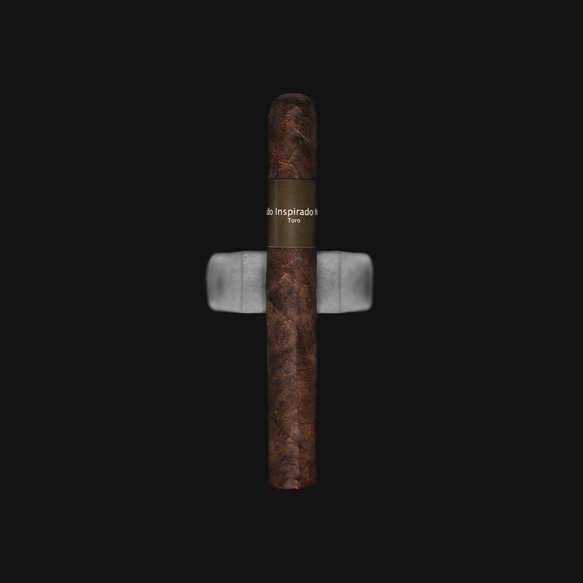 Macanudo Inspirado Red Toro Full Strength Nicaraguan Cigars displayed on a white background, highlighting the deep brown wrapper and vibrant red band.