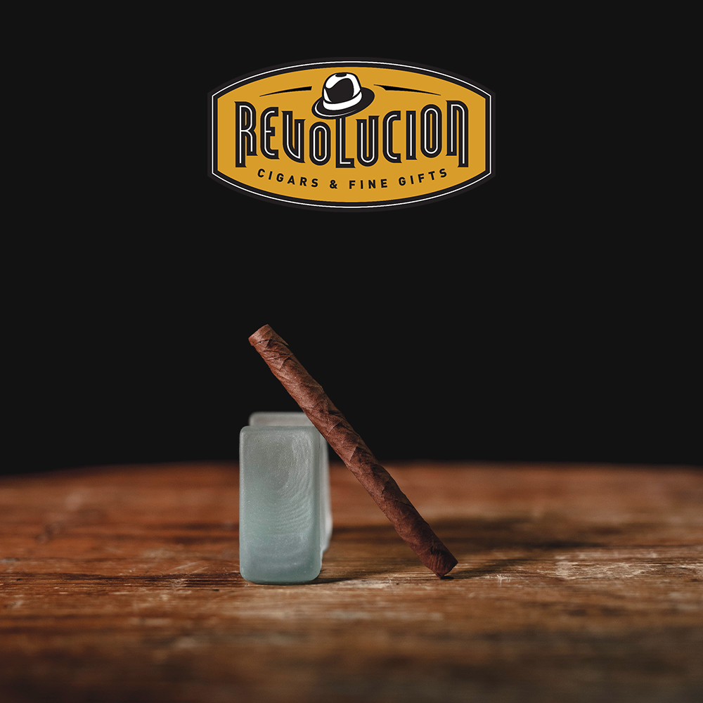 Angled view of a Montecristo Club Mild-Medium Strength Cuban Cigarillo box, showcasing its elegant design.