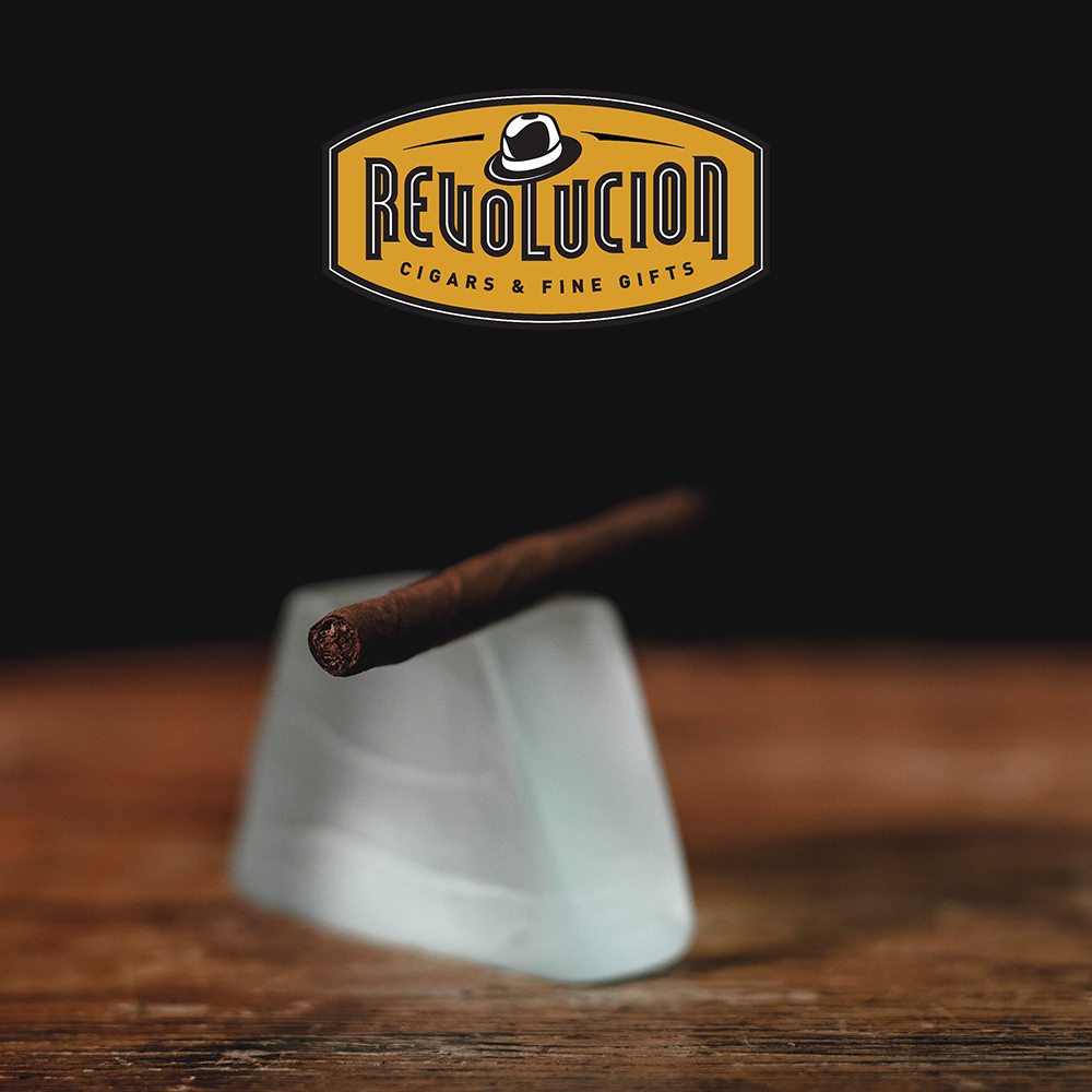 Close-up of the foot of a Montecristo Club Cigarillo, highlighting the finely rolled Cuban tobacco.