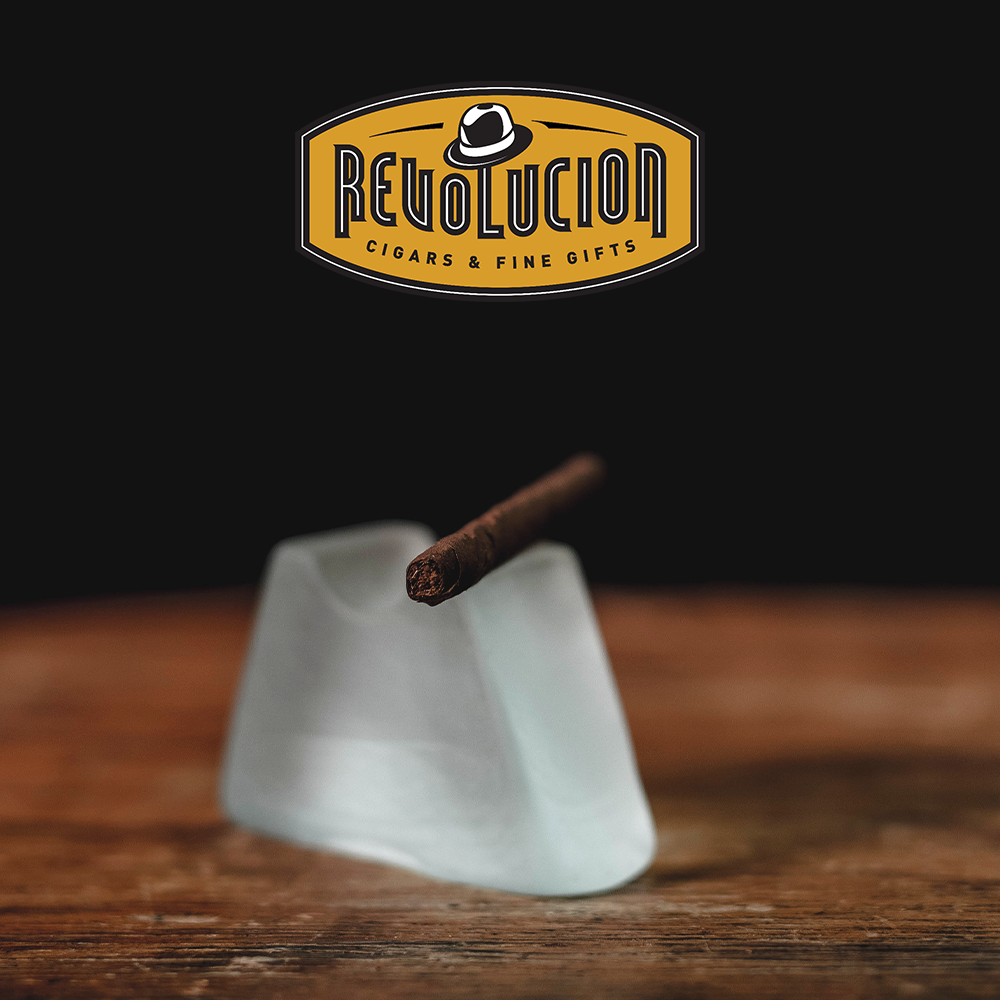 Close-up of the foot of a Montecristo Mini Cigarillo, highlighting the finely rolled Cuban tobacco.