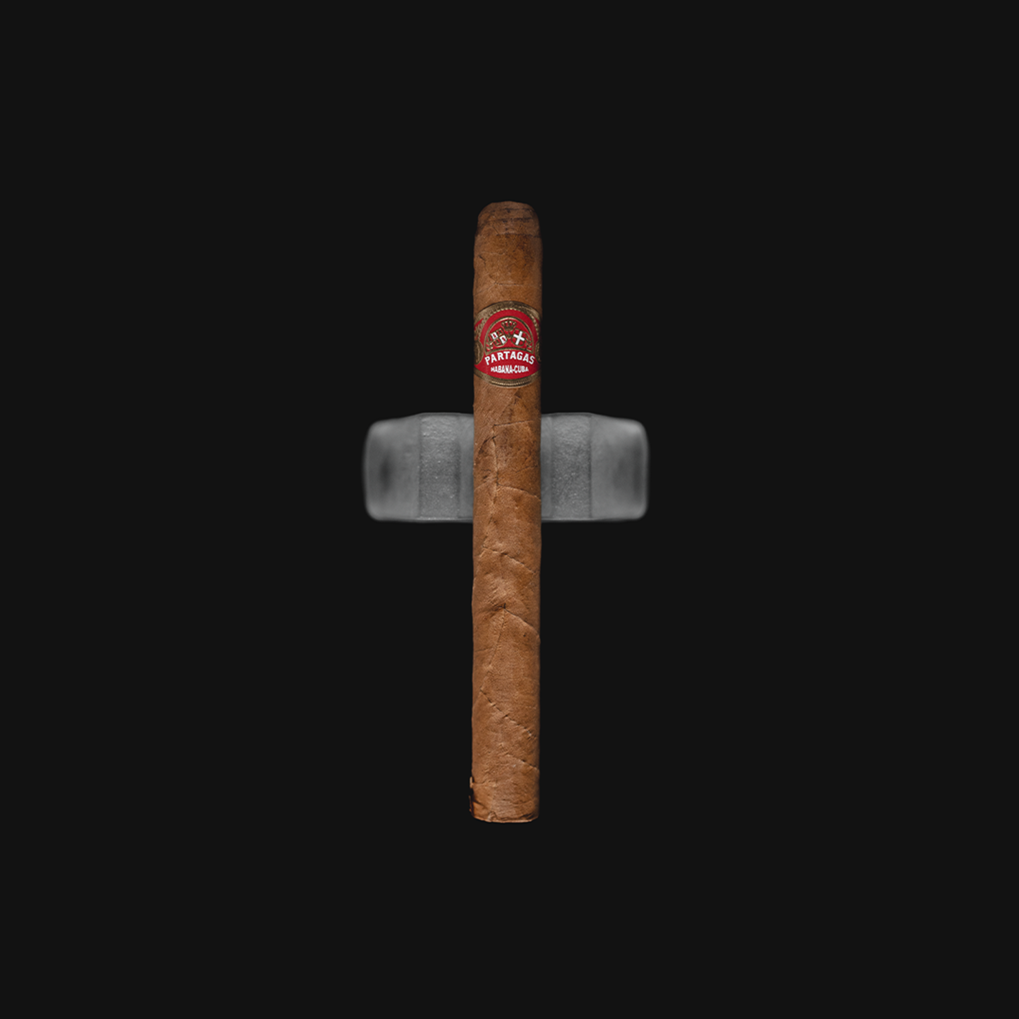 Partagás Mille Fleurs Cuban cigar with a red and gold band, placed on a Black Background.