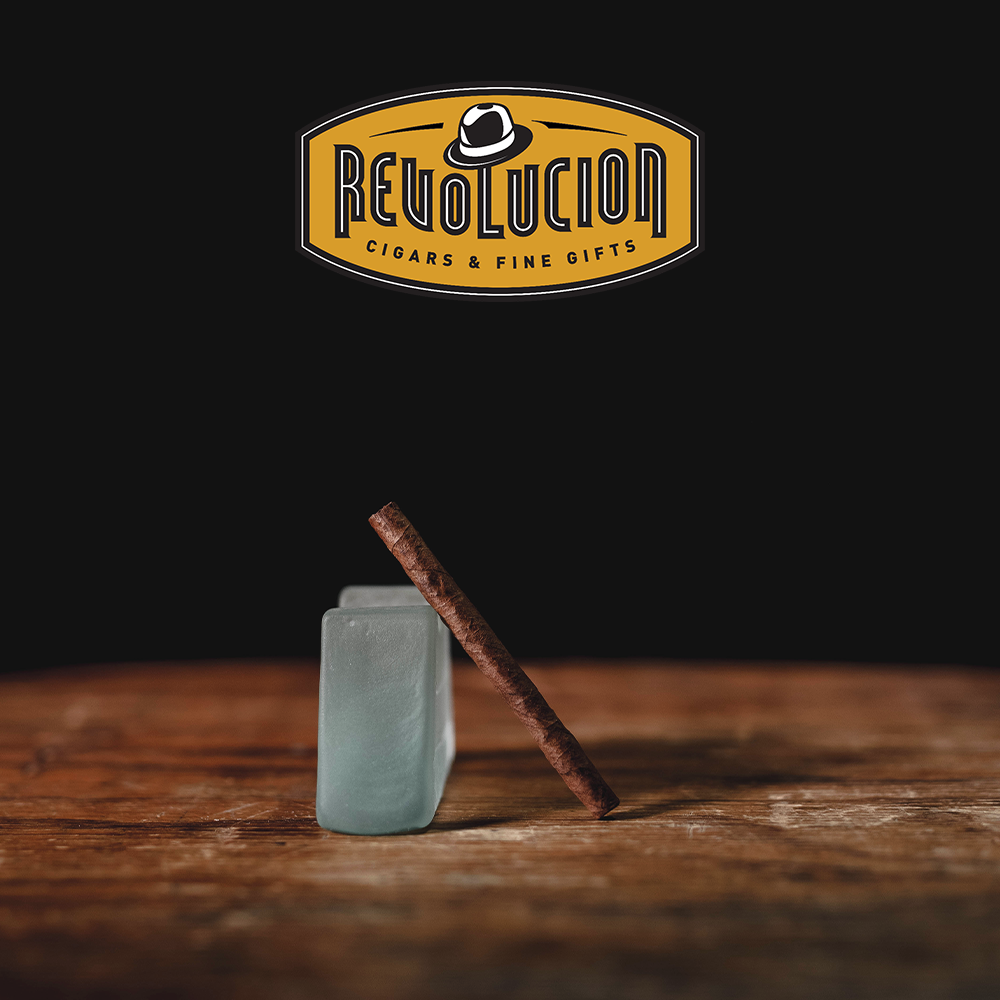 A mild-medium strength Cuban cigarillo positioned at an angle, showcasing its smooth wrapper.